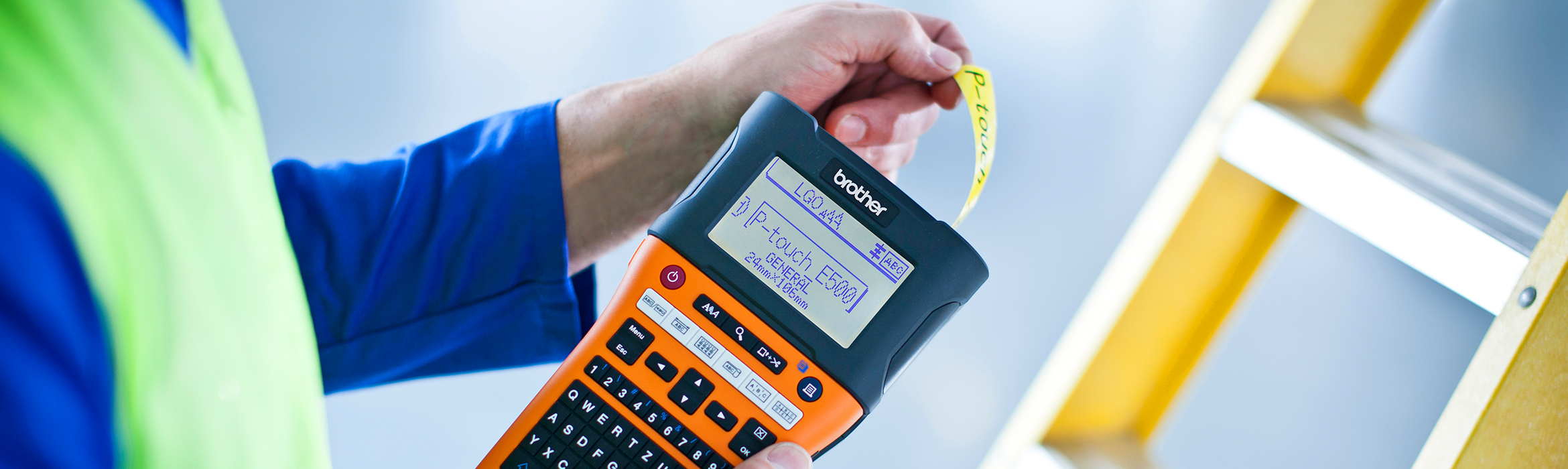 Close-up of electrician using a Brother P-Touch label printer