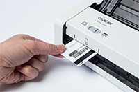 Portable compact document scanner ADS-1200 with ID card being inserted