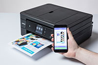 black inkjet printer printing colourful document from a mobile device - MFC-J890DW