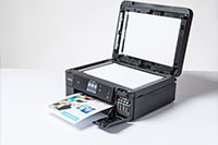 Black inkjet printer printing colourful document with copier lid open - MFC-J890DW