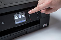 Black inkjet printer with finger pointing to touchscreen - MFC-J890DW