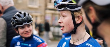 Cyclist Molly Patch talking to team mates