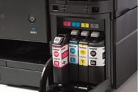 Ink cartridge cover open on Brother printer revealing genuine Brother supplies
