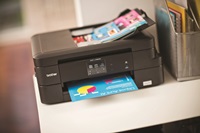 Brother printer on shelf printing colour documents