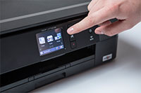 Black inkjet printer with finger touching touchscreen - DCP-J772DW
