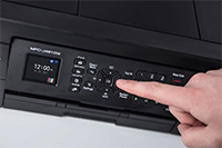 Hand using the cursor control & LCD display on MFC-J491DW