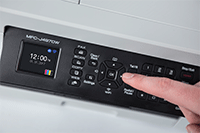 Hand navigating the cursor control on MFC-J497DW