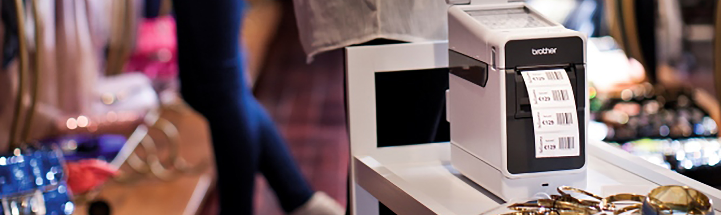Brother desktop label printer being used in a retail store